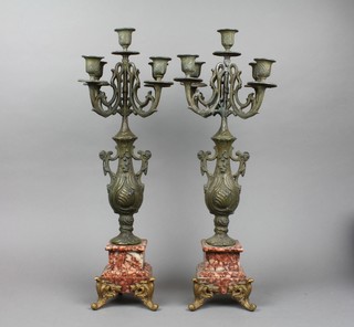 A pair of 5 light spelter baluster candelabra raised on rouge marble bases and gilt scroll feet 22" 