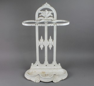 A Victorian style white painted iron umbrella stand 