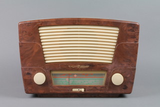 A Radio Rentals radio contained in a brown Bakelite case