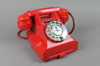 A red dial telephone, the base marked PL.56/3A (crack to base) 