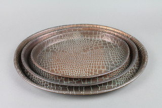 3 Art Nouveau oval graduated copper snake skin effect trays 16", 14" and 11 1/2"