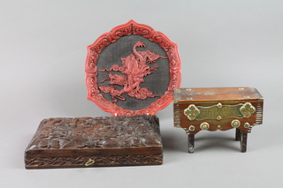A Victorian rectangular oak and brass mounted money box marked Wee Mary's not a fool drops a penny in her stool 6", a heavily carved box with hinged lid 10" and  a circular red cinnabar lacquer tray 9"
