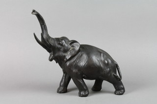 A 19th Century spelter figure of a walking elephant 9 1/2", slight hole