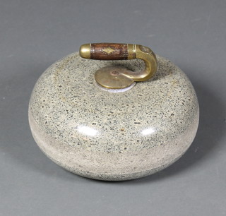 A circular polished granite curling stone 10"