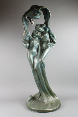 An Art Nouveau style resin figure in the form of 2 standing girls, converted to a table lamp 35"