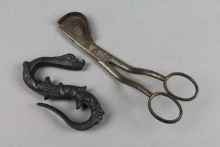 A curious 19th Century bronze S hook in the form of a serpent 3" together with a pair of polished steel wick trimming scissors marked Chalyboid