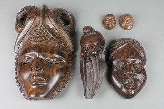 A Japanese carved hardwood mask of a bearded gentleman 10", 2 carved wood masks and 2 others