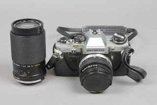 An Olympus OM10 camera with Olympus OM-System Zuiko MC auto-S1:1/8 F=50mm lens and a Miranda 70-210mm 1:4.5-5.6 Macro 052 lens