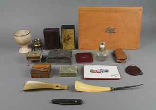 An attache case containing a collection of games and a collection of curios etc