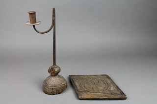A 17th/18th Century wrought iron rush light holder, raised on a turned wooden base (wormed) 12"h together with an oak carved diamond shaped plaque 10" 
