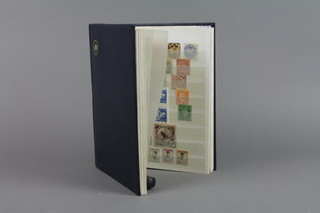 A blue stock book of various World stamps