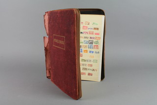 A red leather stock book of American and world stamps