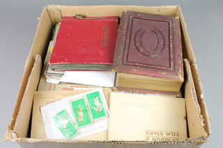A Victorian red leather bound photograph album, 1 other photograph, a collection of postcards and other ephemera etc