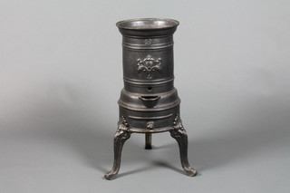 A Victorian cylindrical iron stove raised on 3 cabriole legs 22"h x 9" diam.