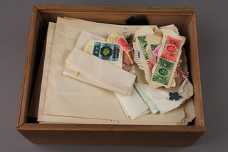 A small stock book and a collection of loose stamps