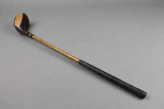 A hickory shafted golf driver, cut down for a child 19"