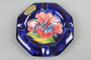 A 1940's Walter Moorcroft octagonal ashtray, the blue ground with stylised hibiscus flower head 4.5"