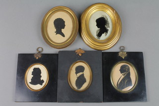 19th Century silhouette miniatures, studies of a gentleman lady and young man in ebonised frames with gilt acorn mounts and 3 others