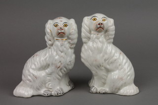 A pair of Victorian Staffordshire Spaniels with gilt decoration 5.5"