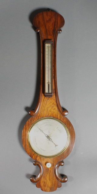 A Victorian mercury barometer by Chadburn Bros. of Sheffield with silvered dial and thermometer contained in a rosewood wheel case 