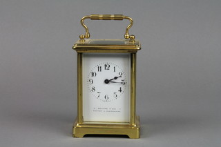A 20th Century carriage clock with enamelled dial and Arabic numerals, contained in a gilt metal case by W Burford & Sons