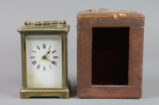 A 19th Century French carriage clock with enamelled dial and Arabic numerals complete with leather travelling case, dial damaged