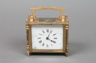 A French carriage clock with rectangular enamelled dial and Roman numerals, contained in a gilt metal case 4"h