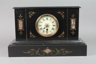 A Victorian 8 day mantel time piece contained in a black marble case