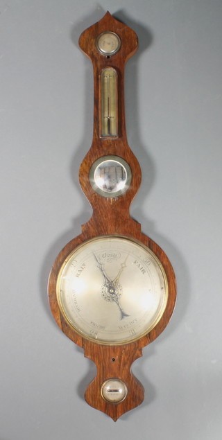 A George III mercury wheel barometer and thermometer contained in a wheel case with damp/dry indicator, brass thermometer, concave mirror above a spirit level marked Arnold of Gloucester 