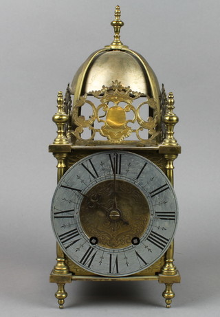 A 19th/20th Century French 8 day striking lantern clock with 5" silvered dial and Arabic numerals contained in a gilt metal case 13" overall