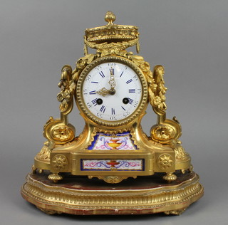 A 19th Century French striking mantel clock with enamelled dial and Roman numerals contained in a gilt ormolu and porcelain mounted case surmounted by a lidded urn, the black painted dial marked VM
