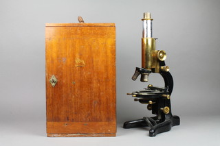 W Watson & Sons of London, a brass single pillar microscope - "Patna" No. 60617 together with guarantee and various accessories