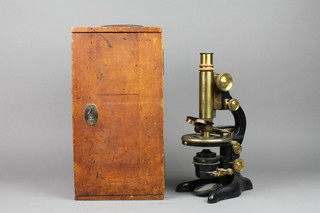 Ernst Leitz Wetzlar, a single pillar microscope no.194823, contained in a mahogany case with 2 extra lenses