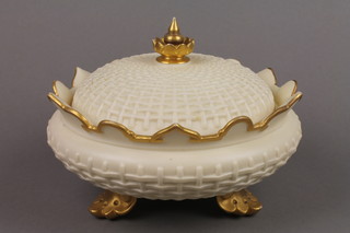 A Royal Worcester blush porcelain squat bowl and cover with basket work decoration on scroll feet 1275 8"
