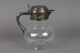 A Victorian silver mounted claret decanter with engraved crest and simple handle with clear body, London 1878, 8"