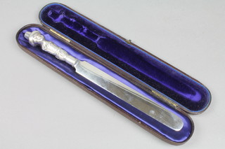 A Victorian silver paper knife with novelty figure handle, London 1839, 12", contained in a fitted case