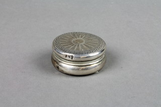 A circular silver engine turned pill box with Greek key pattern decoration, 1.5", Birmingham 1942