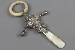 A Victorian style repousse silver teether rattle and soother with momma's pet decoration, Birmingham 1945