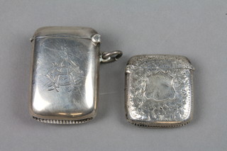 An Edwardian silver vesta case with photo frame Birmingham 1907 and a chased ditto