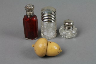 A silver mounted red glass scent bottle 3", 2 clear glass ditto and an acorn needlecase