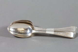A set of 6 Georgian silver bright cut dessert spoons
