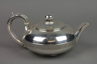 A George III teapot of squat form with reeded decoration and turned finial having acanthus handle and ivory resistors, London 1812, approx. 19 ozs