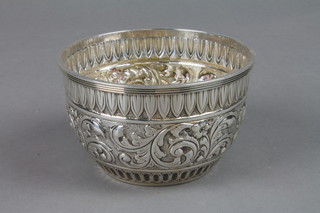 A Victorian repousse silver bowl with scroll and dart decoration, London 1899, approx. 3.3 ozs, 4" 