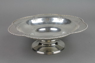 A silver pedestal bowl with egg and dart rim and pierced decoration, Chester 1915, approx. 18 ozs, 10"