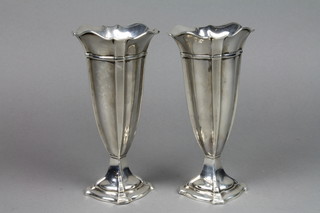 A pair of octagonal tapered silver spill vases with waisted bases, Sheffield 1923, 7" 