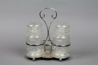 2 cut glass pickle jars in a plated stand