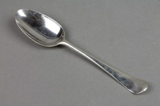 A Georgian silver table spoon with engraved monogram London 1766
