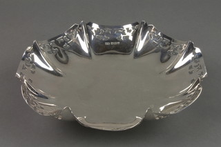 An octagonal silver waisted dish with cut floral decoration, Sheffield 1948, approx. 8 ozs 
