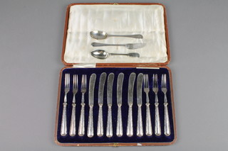 A set of 6 silver dessert eaters - cased and a silver fork and spoon