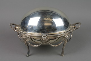 An Edwardian plated breakfast warmer of Adam design with rams head and swag decoration on hoof feet 13"